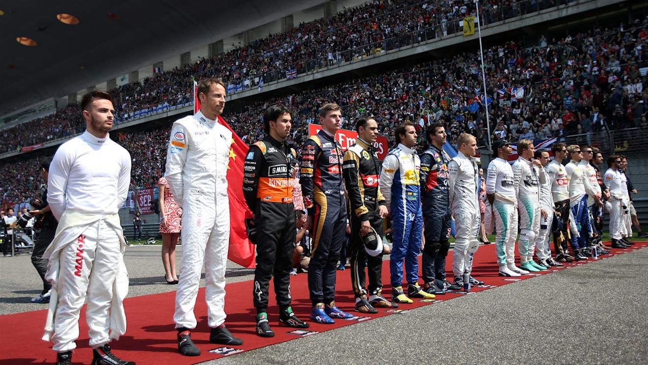 Drivers observe the National Anthem on the grid at Formula One World Championship, Rd3, Chinese Grand Prix, Race, Shanghai, China, Sunday 12 April 2015. © Sutton Motorsport Images