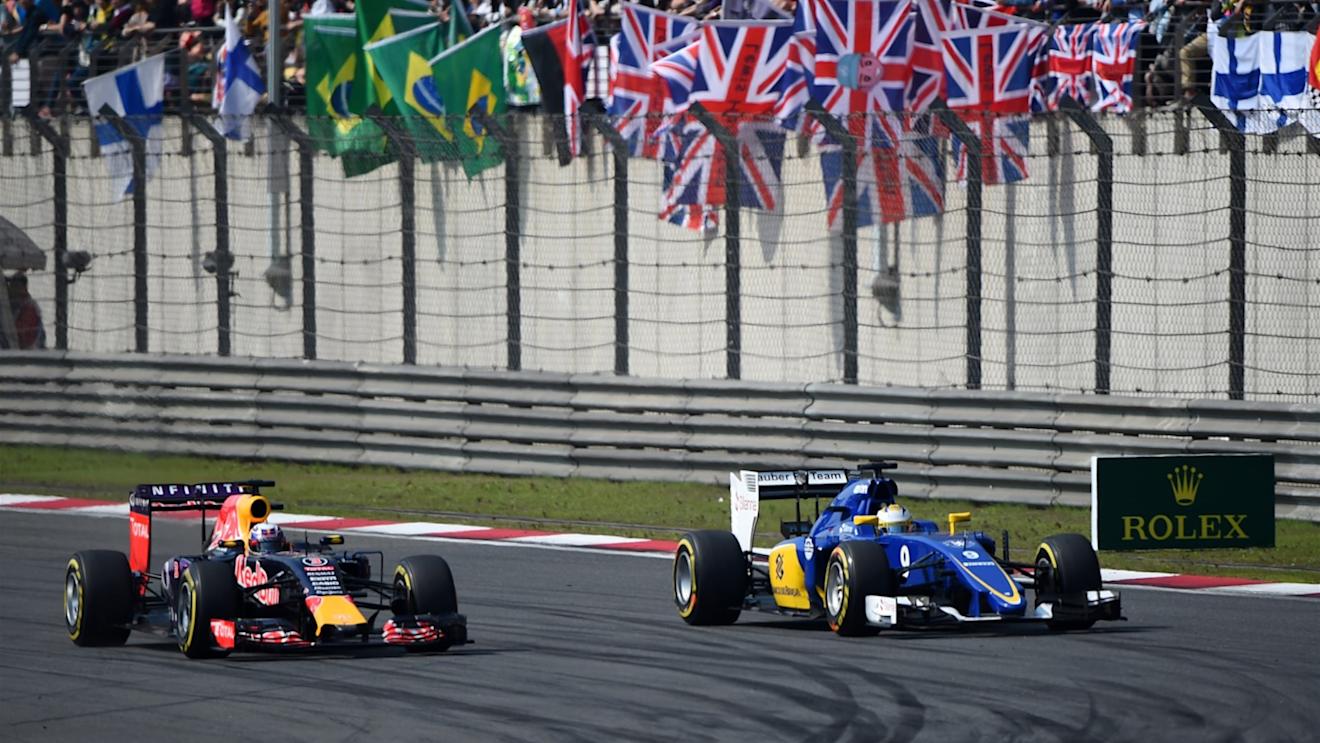 Daniel Ricciardo (AUS) Red Bull Racing RB11 and Marcus Ericsson (SWE) Sauber C34 battle at Formula One World Championship, Rd3, Chinese Grand Prix, Race, Shanghai, China, Sunday 12 April 2015. © Sutton Motorsport Images