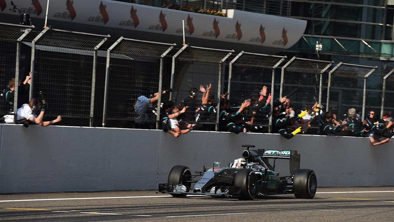 Race winner Lewis Hamilton (GBR) Mercedes AMG F1 W06 crosses the line and passes his team at Formula One World Championship, Rd3, Chinese Grand Prix, Race, Shanghai, China, Sunday 12 April 2015. © Sutton Motorsport Images