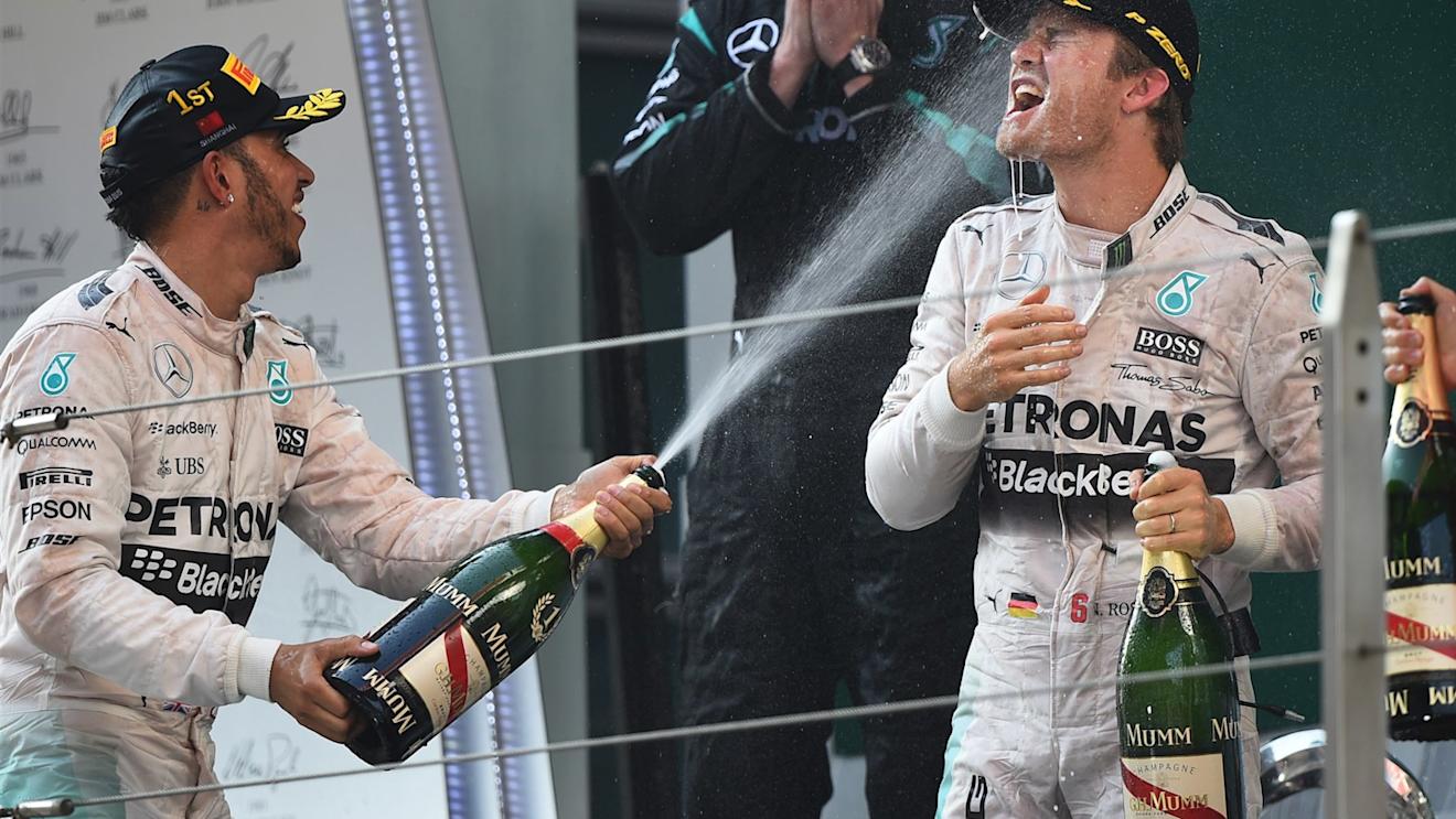 Lewis Hamilton (GBR) Mercedes AMG F1 and Nico Rosberg (GER) Mercedes AMG F1 celebrate on the podium with the champagne Formula One World Championship, Rd3, Chinese Grand Prix, Race, Shanghai, China, Sunday 12 April 2015. © Sutton Motorsport Images