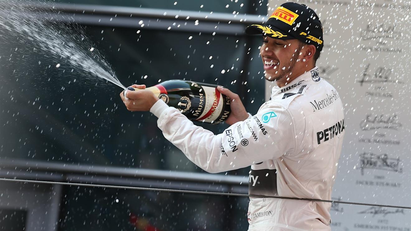 Race winner Lewis Hamilton (GBR) Mercedes AMG F1 celebrates with champagne on the podium at Formula One World Championship, Rd3, Chinese Grand Prix, Race, Shanghai, China, Sunday 12 April 2015. © Sutton Motorsport Images