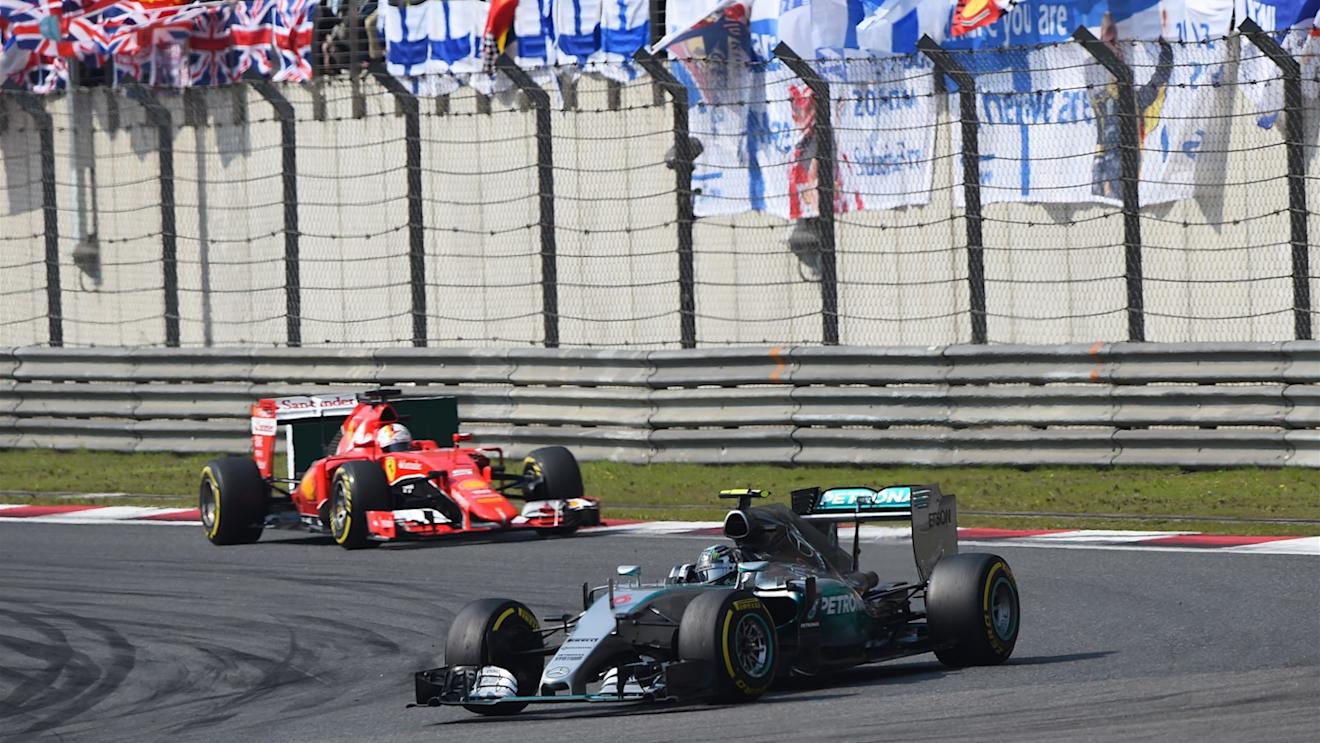 Nico Rosberg (GER) Mercedes AMG F1 W06 leads Sebastian Vettel (GER) Ferrari SF15-T at Formula One World Championship, Rd3, Chinese Grand Prix, Race, Shanghai, China, Sunday 12 April 2015. © Sutton Motorsport Images