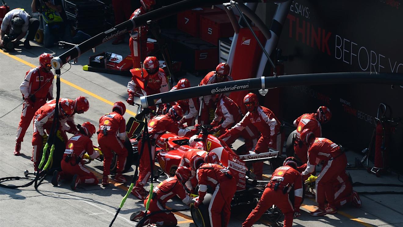 Sebastian Vettel (GER) Ferrari SF15-T pit stop at Formula One World Championship, Rd3, Chinese Grand Prix, Race, Shanghai, China, Sunday 12 April 2015. © Sutton Motorsport Images