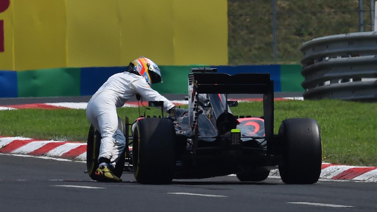 Fernando Alonso (ESP) McLaren MP4-30 pushing his car at Formula One World Championship, Rd10, Hungarian Grand Prix, Qualifying, Hungaroring, Hungary, Saturday 25 July 2015. © Sutton Motorsport Images