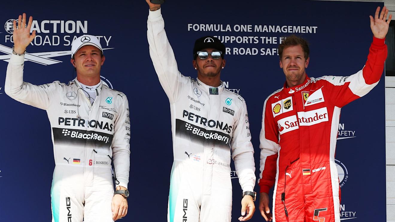 (L to R): Nico Rosberg (GER) Mercedes AMG F1, pole sitter Lewis Hamilton (GBR) Mercedes AMG F1 and Sebastian Vettel (GER) Ferrari celebrate in parc ferme at Formula One World Championship, Rd10, Hungarian Grand Prix, Qualifying, Hungaroring, Hungary, Saturday 25 July 2015. © Sutton Motorsport Images