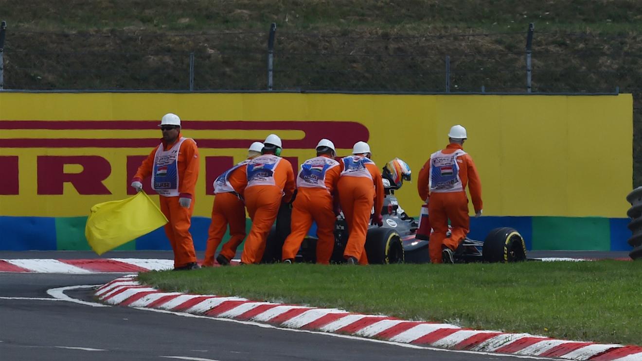 Marshalsand Fernando Alonso (ESP) McLaren MP4-30 push his car into pit lane during Q2 at Formula One World Championship, Rd10, Hungarian Grand Prix, Qualifying, Hungaroring, Hungary, Saturday 25 July 2015. © Sutton Motorsport Images