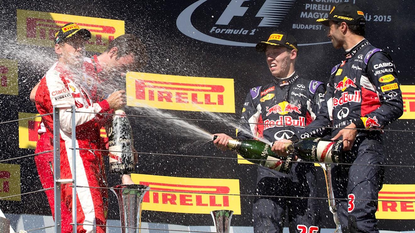 Race winner Sebastian Vettel (GER) Ferrari, James Allison (GBR) Ferrari Chassis Technical Director, Daniel Ricciardo (AUS) Red Bull Racing and Daniil Kvyat (RUS) Red Bull Racing celebrate on the podium with the champagne at Formula One World Championship, Rd10, Hungarian Grand Prix, Race, Hungaroring, Hungary, Sunday 26 July 2015. © Sutton Motorsport Images