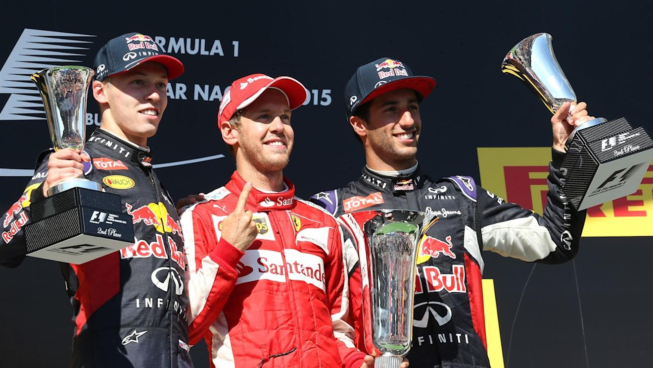(L to R): Daniil Kyvat (RUS) Red Bull Racing, Race winner Sebastian Vettel (GER) Ferrari and Daniel Ricciardo (AUS) Red Bull Racing celebrate with the trophy on the podium  at Formula One World Championship, Rd10, Hungarian Grand Prix, Race, Hungaroring, Hungary, Sunday 26 July 2015. © Sutton Motorsport Images
