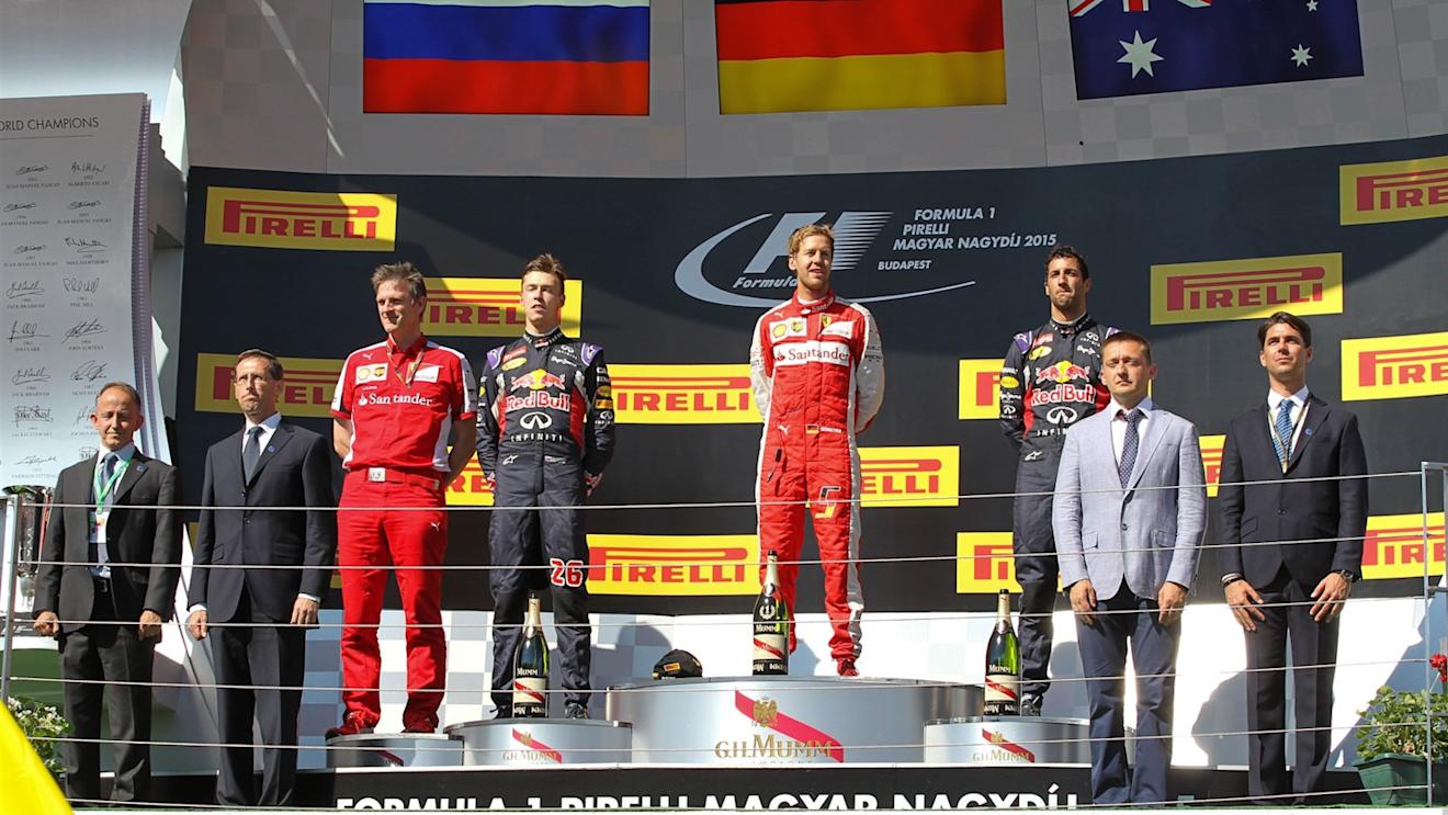 (L to R): Daniil Kyvat (RUS) Red Bull Racing, Race winner Sebastian Vettel (GER) Ferrari and Daniel Ricciardo (AUS) Red Bull Racing celebrate  on the podium at Formula One World Championship, Rd10, Hungarian Grand Prix, Race, Hungaroring, Hungary, Sunday 26 July 2015. © Sutton Motorsport Images