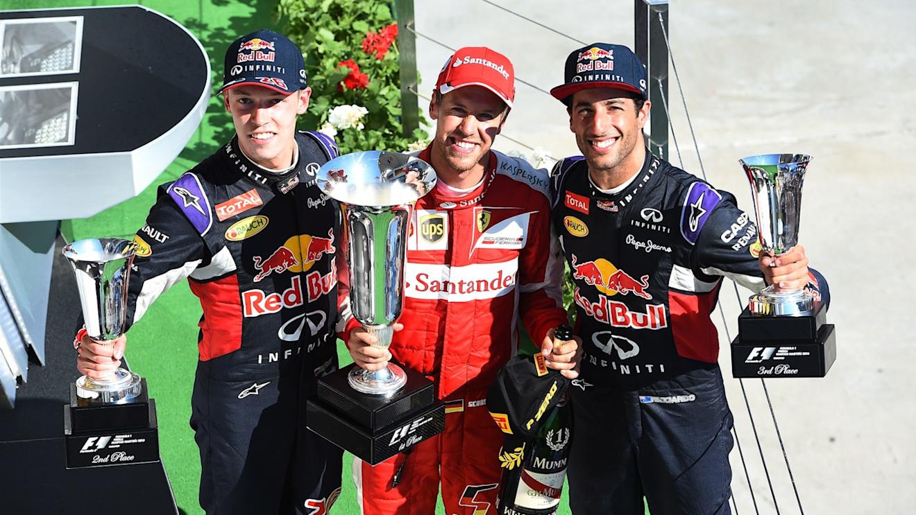 Daniil Kyvat (RUS) Red Bull Racing, race winner Sebastian Vettel (GER) Ferrari and Daniel Ricciardo (AUS) Red Bull Racing celebrate with the trophies on the podium at Formula One World Championship, Rd10, Hungarian Grand Prix, Race, Hungaroring, Hungary, Sunday 26 July 2015. © Sutton Motorsport Images