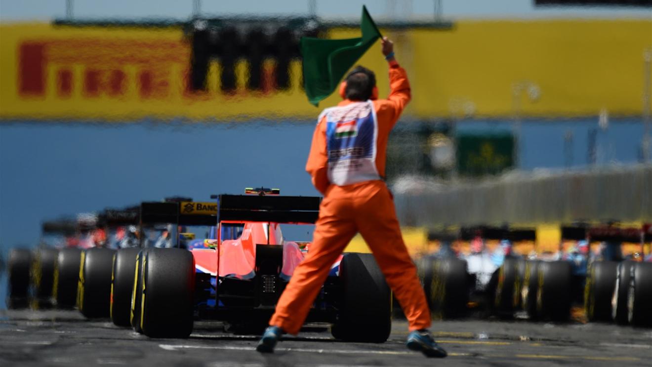 Marshal on the start grid at Formula One World Championship, Rd10, Hungarian Grand Prix, Race, Hungaroring, Hungary, Sunday 26 July 2015. © Sutton Motorsport Images