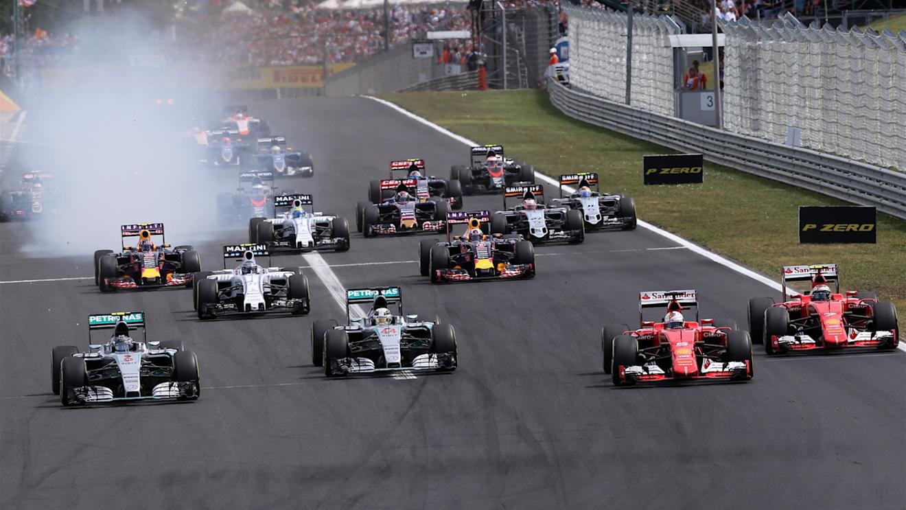 Nico Rosberg (GER) Mercedes AMG F1 W06, Lewis Hamilton (GBR) Mercedes AMG F1 W06, Sebastian Vettel (GER) Ferrari SF15-T and Kimi Raikkonen (FIN) Ferrari SF15-T at the start of the race at Formula One World Championship, Rd10, Hungarian Grand Prix, Race, Hungaroring, Hungary, Sunday 26 July 2015. © Sutton Motorsport Images