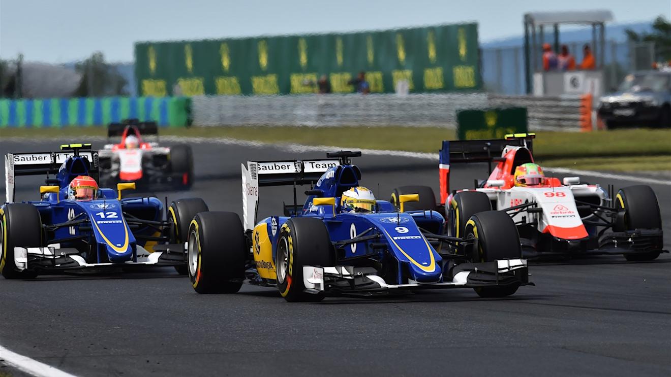 Marcus Ericsson (SWE) Sauber C34, Felipe Nasr (BRA) Sauber C34 and Roberto Merhi (ESP) Manor GP battle at Formula One World Championship, Rd10, Hungarian Grand Prix, Race, Hungaroring, Hungary, Sunday 26 July 2015. © Sutton Motorsport Images