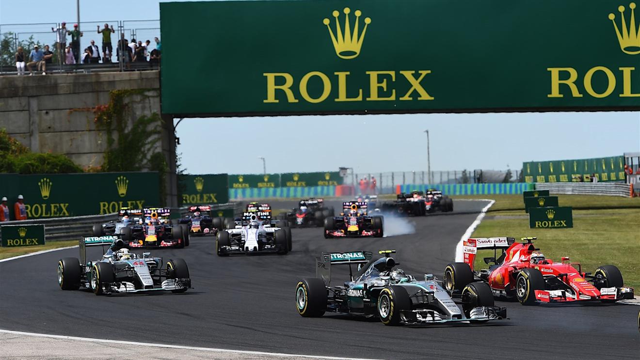 Nico Rosberg (GER) Mercedes AMG F1 W06 and Kimi Raikkonen (FIN) Ferrari SF15-T battle at the strat of the race at Formula One World Championship, Rd10, Hungarian Grand Prix, Race, Hungaroring, Hungary, Sunday 26 July 2015. © Sutton Motorsport Images