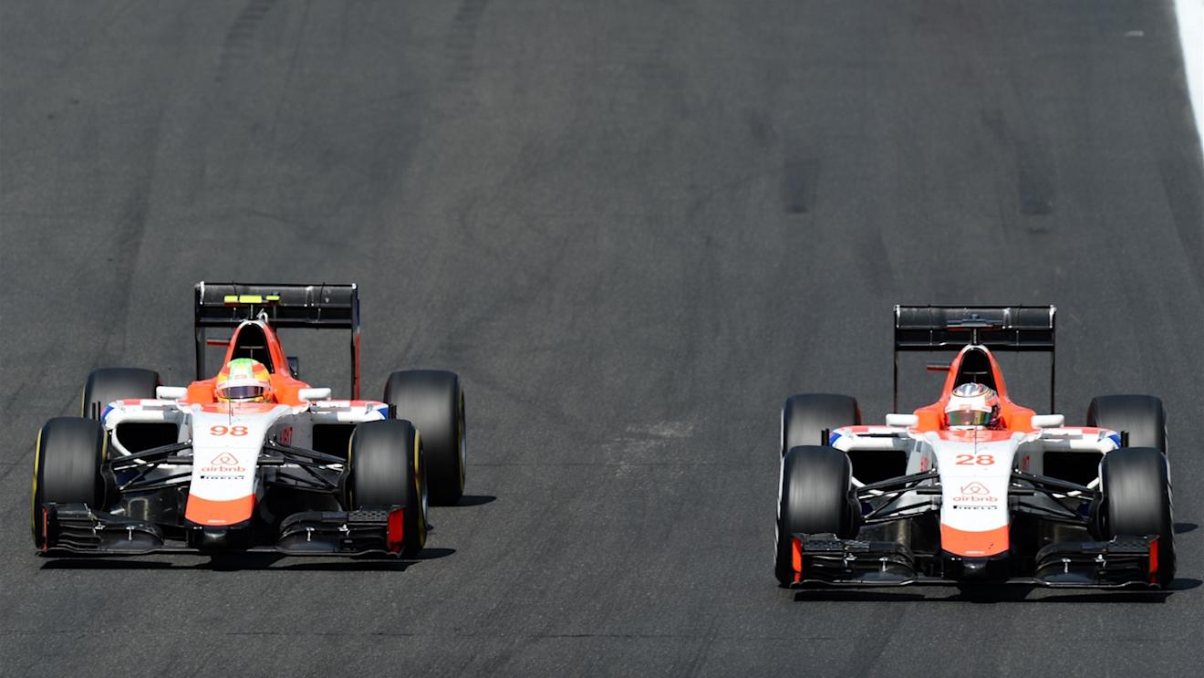 Roberto Merhi (ESP) Manor GP and Will Stevens (GBR) Manor GP battle at Formula One World Championship, Rd10, Hungarian Grand Prix, Race, Hungaroring, Hungary, Sunday 26 July 2015. © Sutton Motorsport Images