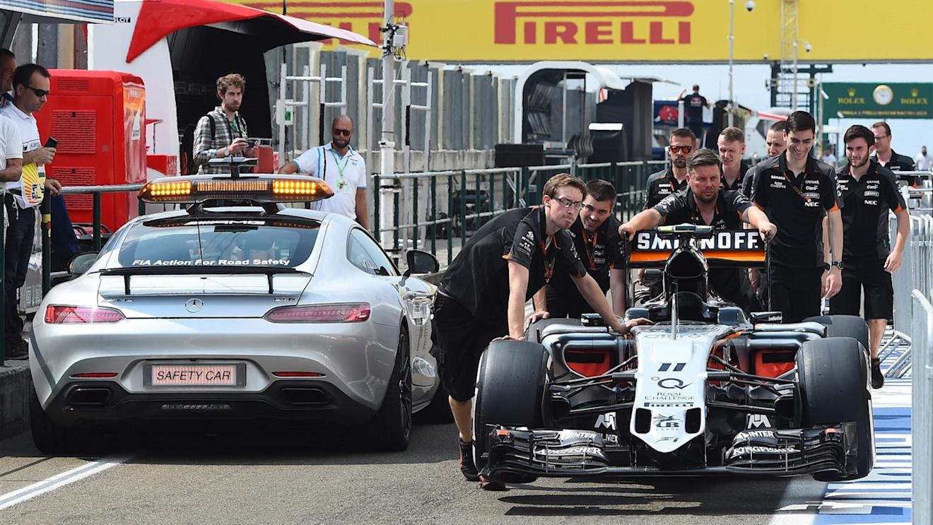 FIA safety car passes the Force India VJM08 as its pushed down the pitlane by mechanics at Formula One World Championship, Rd10, Hungarian Grand Prix, Preparations, Hungaroring, Hungary, Thursday 23 July 2015. © Sutton Motorsport Images