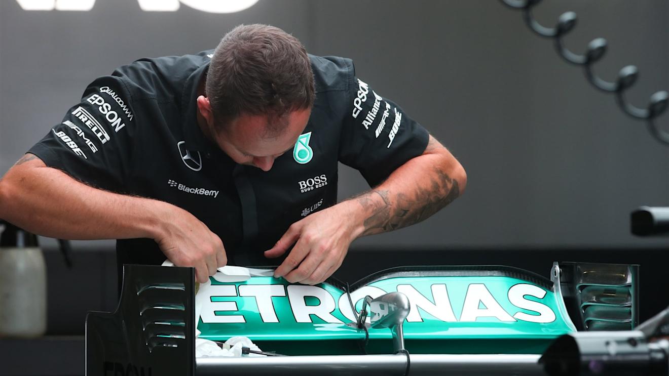 Mercedes mechanic works on Mercedes AMG F1 W06 rear wing at Formula One World Championship, Rd14, Japanese Grand Prix, Practice, Suzuka, Japan, Friday 25 September 2015. © Sutton Motorsport Images