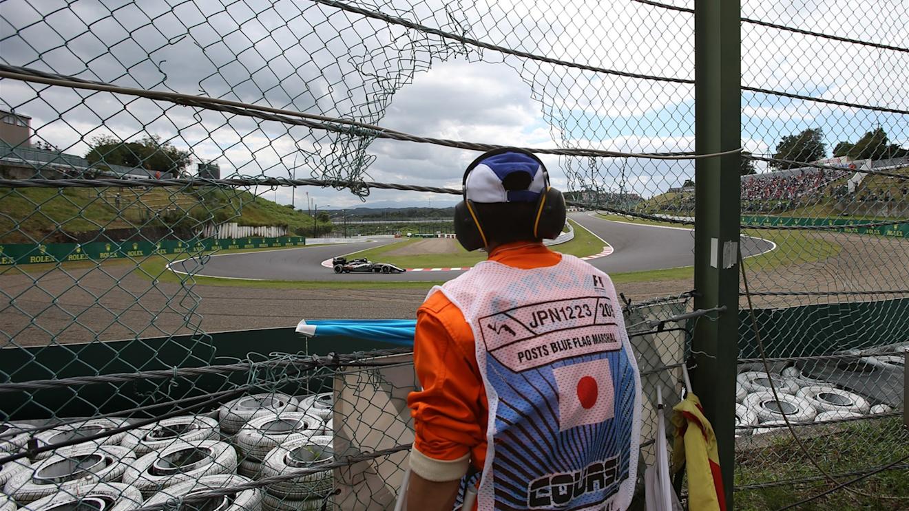Marshal watches Sergio Perez (MEX) Force India VJM08 at Formula One World Championship, Rd14, Japanese Grand Prix, Qualifying, Suzuka, Japan, Saturday 26 September 2015. © Sutton Motorsport Images