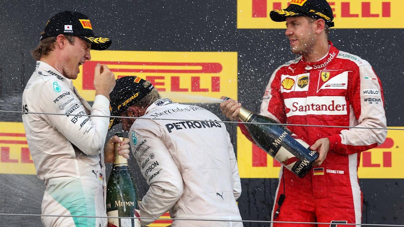 Nico Rosberg (GER) Mercedes AMG F1, Race winner Lewis Hamilton (GBR) Mercedes AMG F1 and Sebastian Vettel (GER) Ferrari celebrate with the champagne on the podium at Formula One World Championship, Rd14, Japanese Grand Prix, Race, Suzuka, Japan, Sunday 27 September 2015. © Sutton Motorsport Images