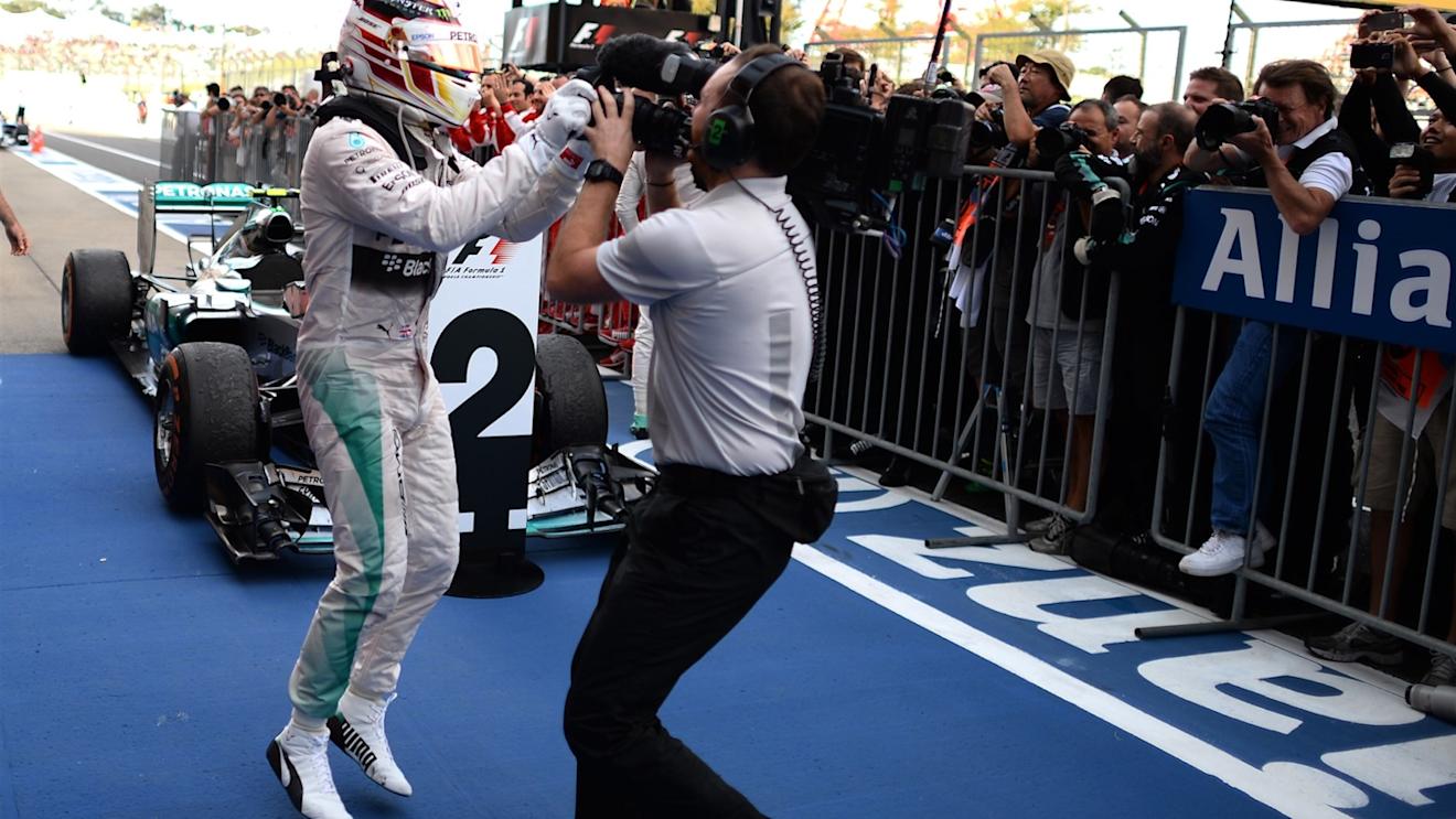 Race winner Lewis Hamilton (GBR) Mercedes AMG F1 celebrates in parc ferme at Formula One World Championship, Rd14, Japanese Grand Prix, Race, Suzuka, Japan, Sunday 27 September 2015. © Sutton Motorsport Images