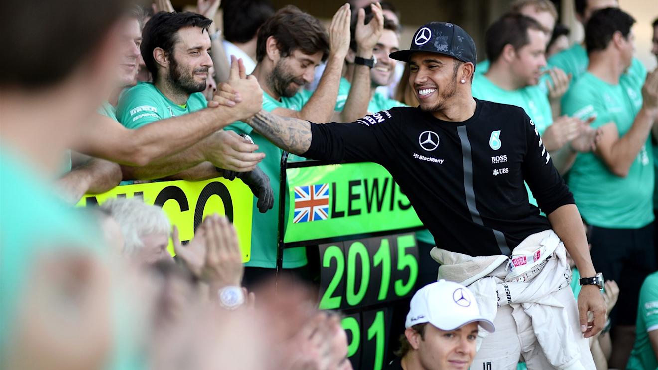 Race winner Lewis Hamilton (GBR) Mercedes AMG F1 celebrates with the team at Formula One World Championship, Rd14, Japanese Grand Prix, Race, Suzuka, Japan, Sunday 27 September 2015. © Sutton Motorsport Images