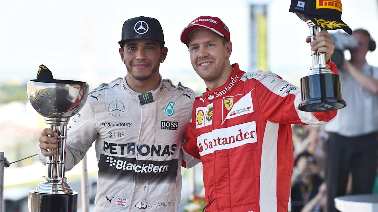 Race winner Lewis Hamilton (GBR) Mercedes AMG F1 and Sebastian Vettel (GER) Ferrari celebrate on the podium with the trophies at Formula One World Championship, Rd14, Japanese Grand Prix, Race, Suzuka, Japan, Sunday 27 September 2015. © Sutton Motorsport Images