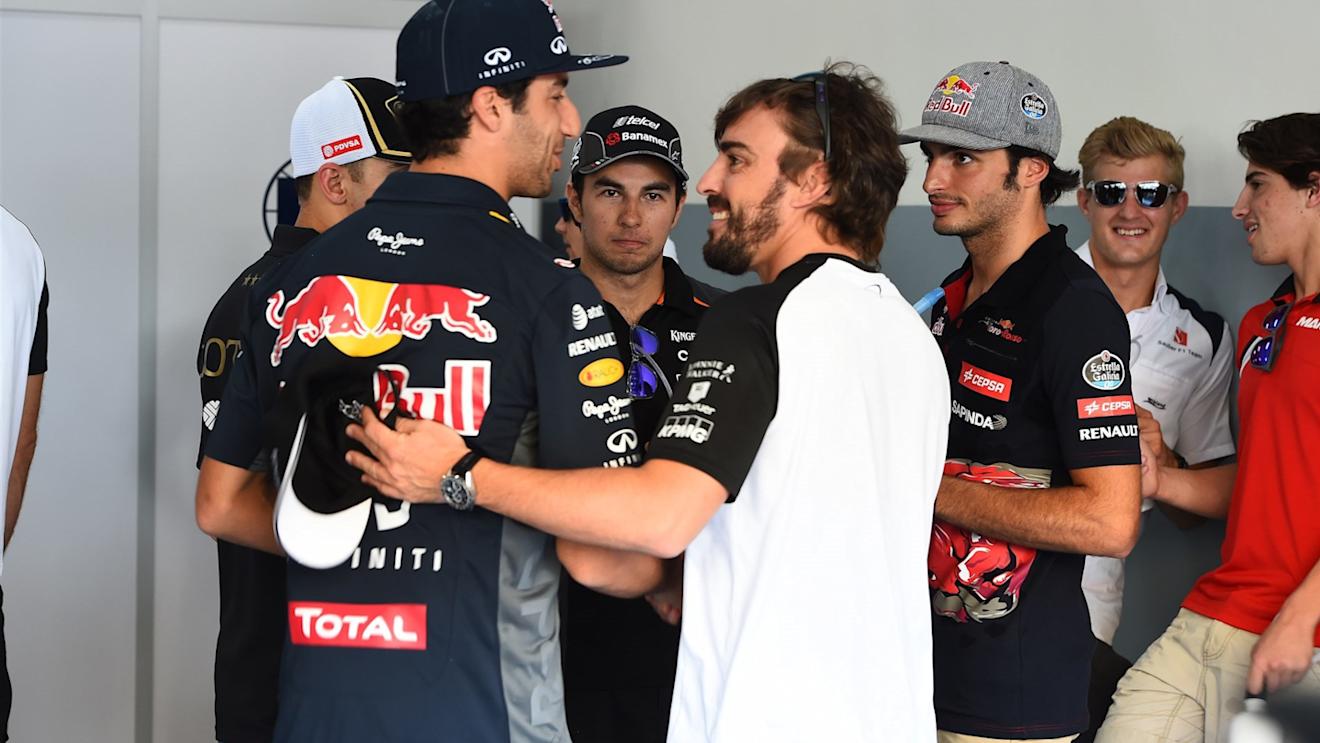 Daniel Ricciardo (AUS) Red Bull Racing and Fernando Alonso (ESP) McLaren on the drivers parade  at Formula One World Championship, Rd2, Malaysian Grand Prix, Race, Sepang, Malaysia, Sunday 29 March 2015. © Sutton Motorsport Images