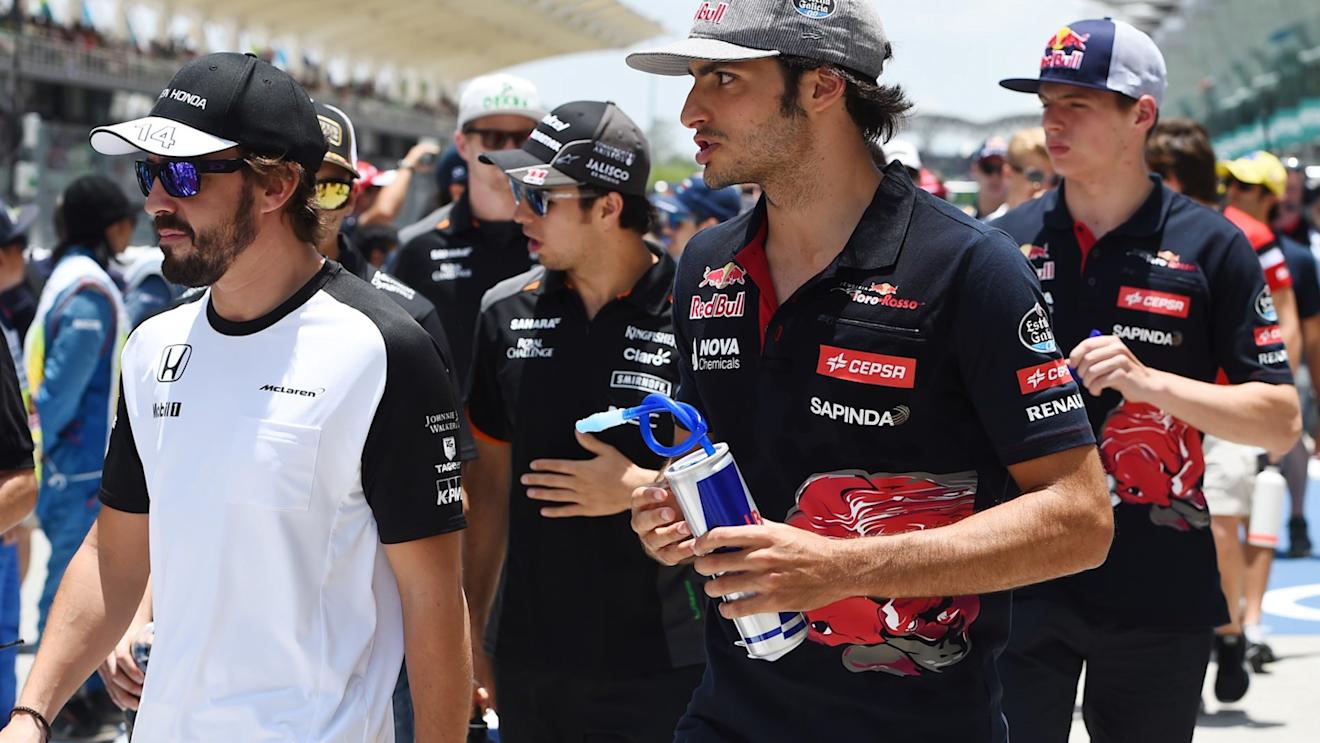 Fernando Alonso (ESP) McLaren and Carlos Sainz jr (ESP) Scuderia Toro Rosso on the drivers parade at Formula One World Championship, Rd2, Malaysian Grand Prix, Race, Sepang, Malaysia, Sunday 29 March 2015. © Sutton Motorsport Images