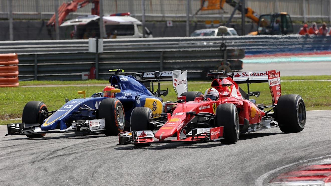 Sebastian Vettel (GER) Ferrari SF15-T and Felipe Nasr (BRA) Sauber C34 battle at Formula One World Championship, Rd2, Malaysian Grand Prix, Race, Sepang, Malaysia, Sunday 29 March 2015. © Sutton Motorsport Images