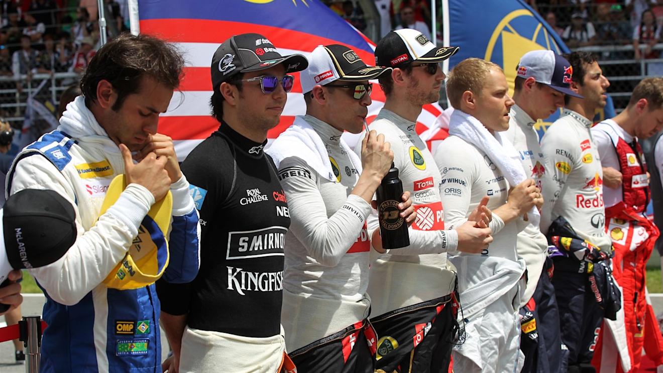 Drivers abserve the National Anthem on the grid at Formula One World Championship, Rd2, Malaysian Grand Prix, Race, Sepang, Malaysia, Sunday 29 March 2015. © Sutton Motorsport Images