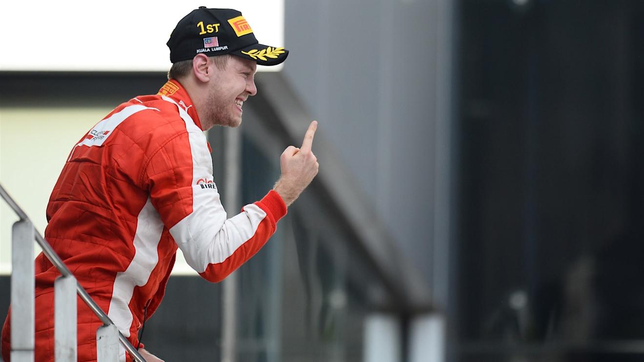 Sebastian Vettel (GER) Ferrari celebrates on the podium at Formula One World Championship, Rd2, Malaysian Grand Prix, Race, Sepang, Malaysia, Sunday 29 March 2015. © Sutton Motorsport Images