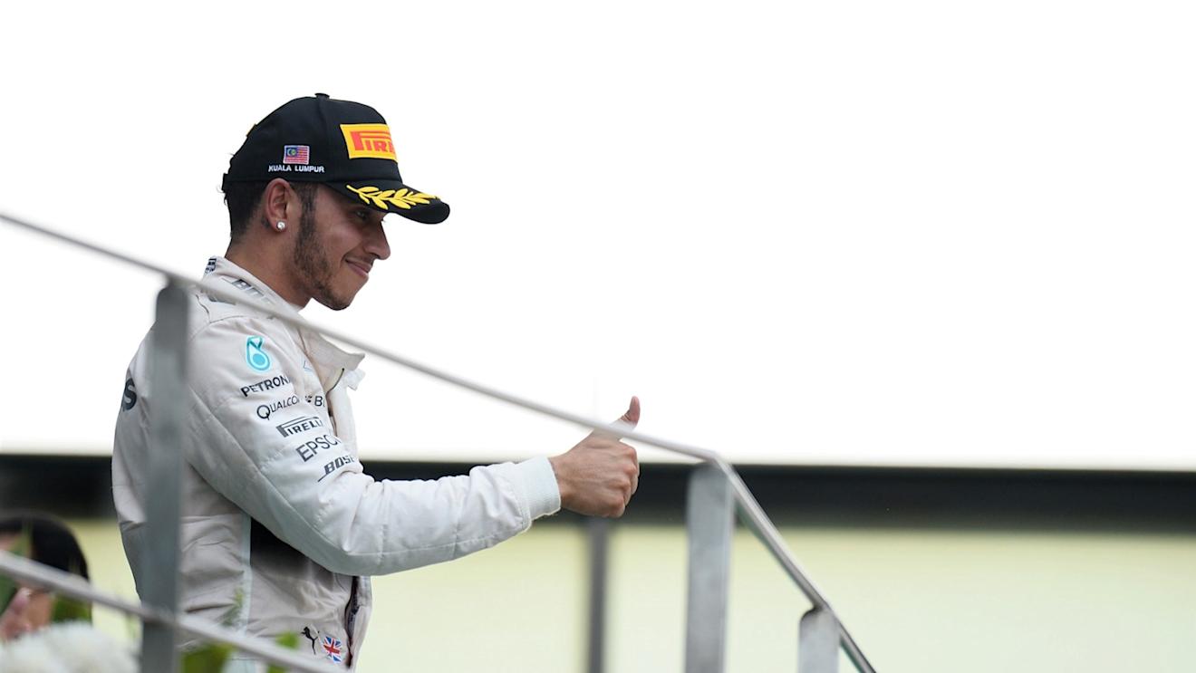 Lewis Hamilton (GBR) Mercedes AMG F1 celebrates on the Podium at Formula One World Championship, Rd2, Malaysian Grand Prix, Race, Sepang, Malaysia, Sunday 29 March 2015. © Sutton Motorsport Images