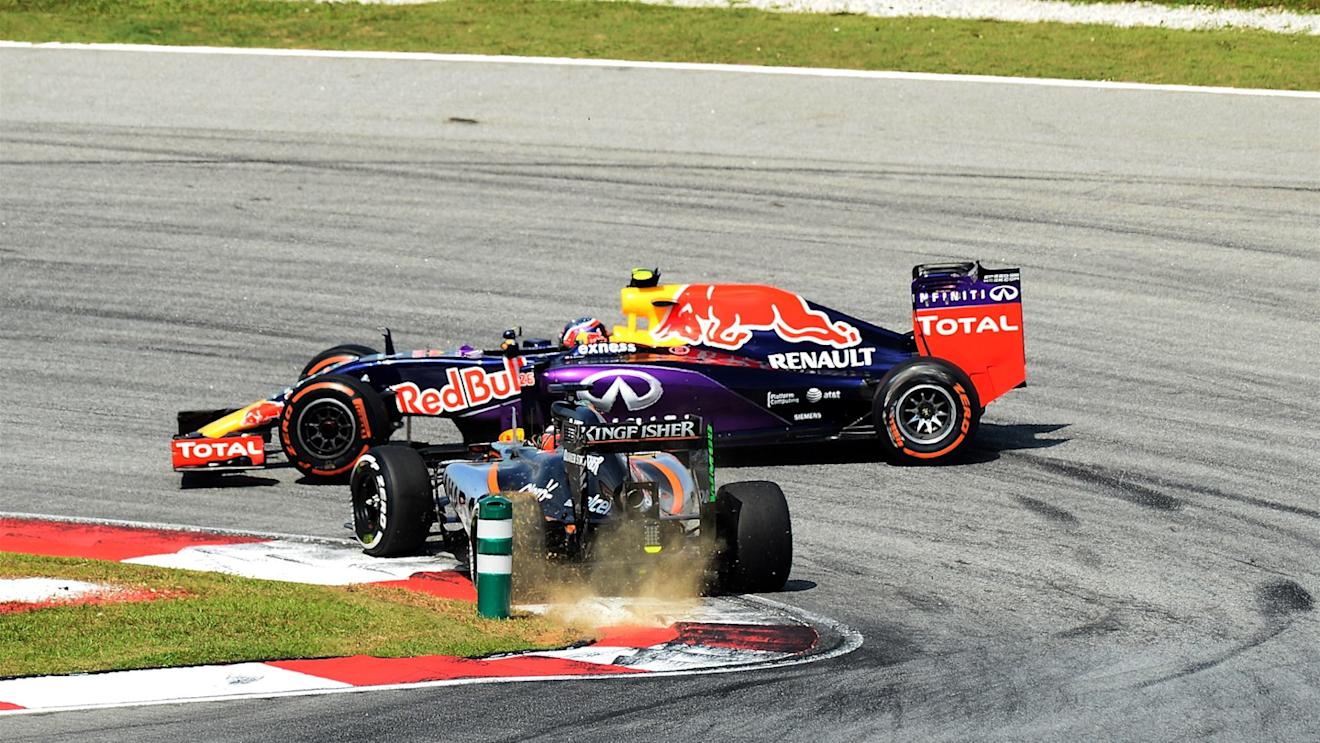 Nico Hulkenberg (GER) Force India VJM08 and Daniil Kvyat (RUS) Red Bull Racing RB11 come together at Formula One World Championship, Rd2, Malaysian Grand Prix, Race, Sepang, Malaysia, Sunday 29 March 2015. © Sutton Motorsport Images