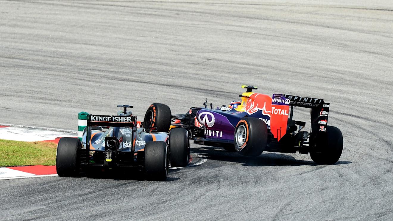 Nico Hulkenberg (GER) Force India VJM08 and Daniil Kvyat (RUS) Red Bull Racing RB11 come together at Formula One World Championship, Rd2, Malaysian Grand Prix, Race, Sepang, Malaysia, Sunday 29 March 2015. © Sutton Motorsport Images