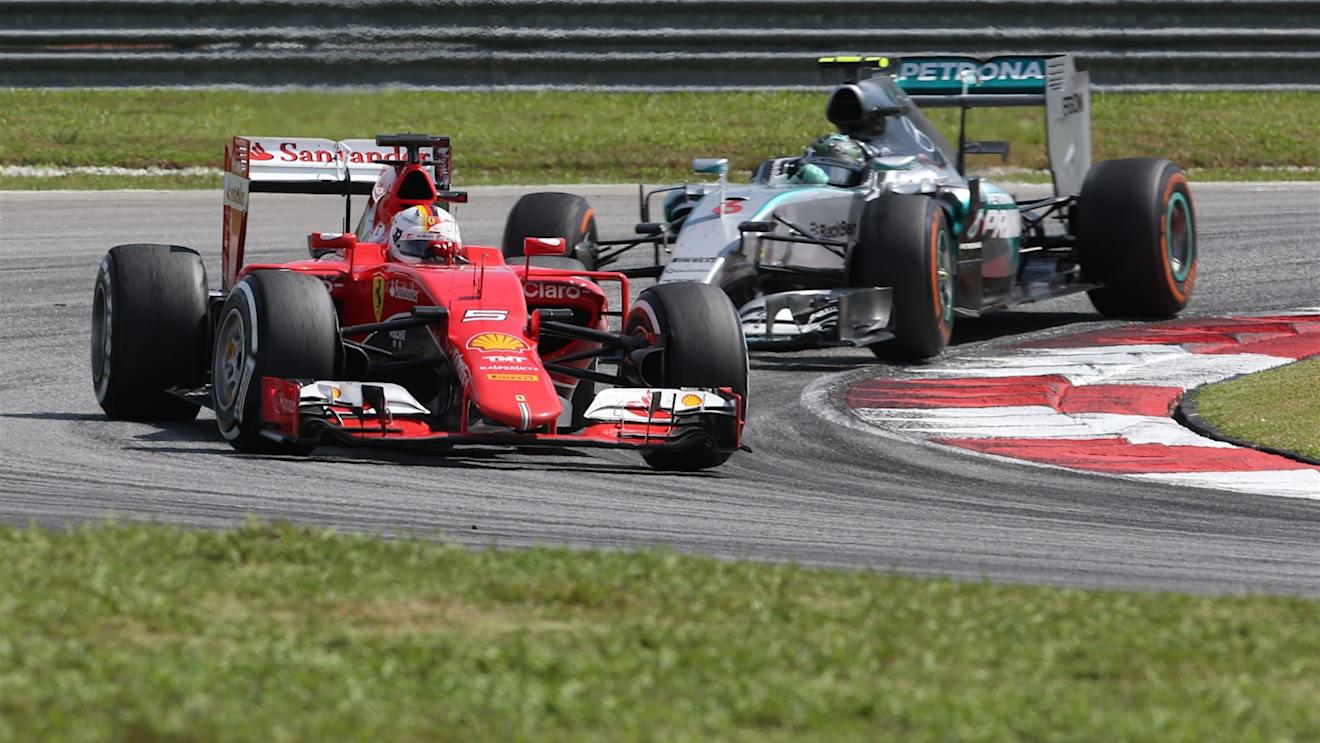 Sebastian Vettel (GER) Ferrari SF15-T leads Nico Rosberg (GER) Mercedes AMG F1 W06 at Formula One World Championship, Rd2, Malaysian Grand Prix, Race, Sepang, Malaysia, Sunday 29 March 2015. © Sutton Motorsport Images