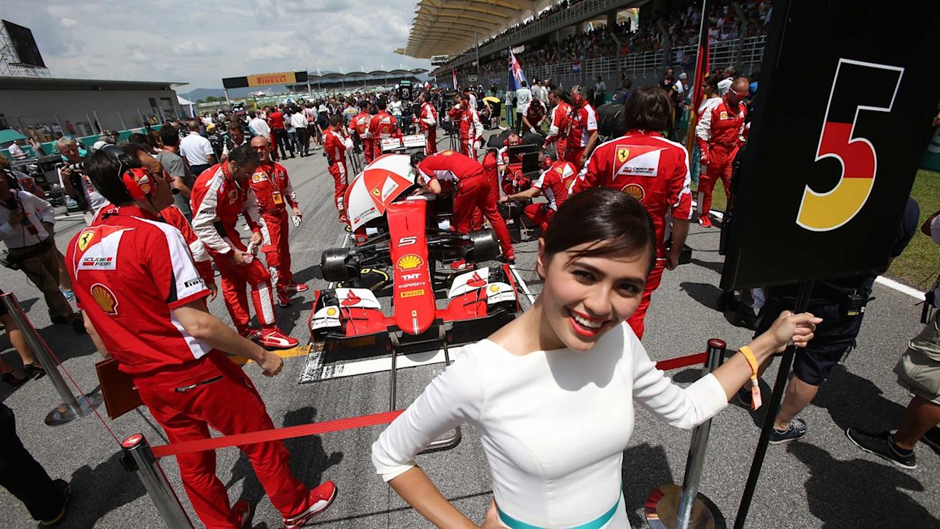 Sebastian Vettel (GER) Ferrari SF15-T and grid girl on the grid at Formula One World Championship, Rd2, Malaysian Grand Prix, Race, Sepang, Malaysia, Sunday 29 March 2015. © Sutton Motorsport Images