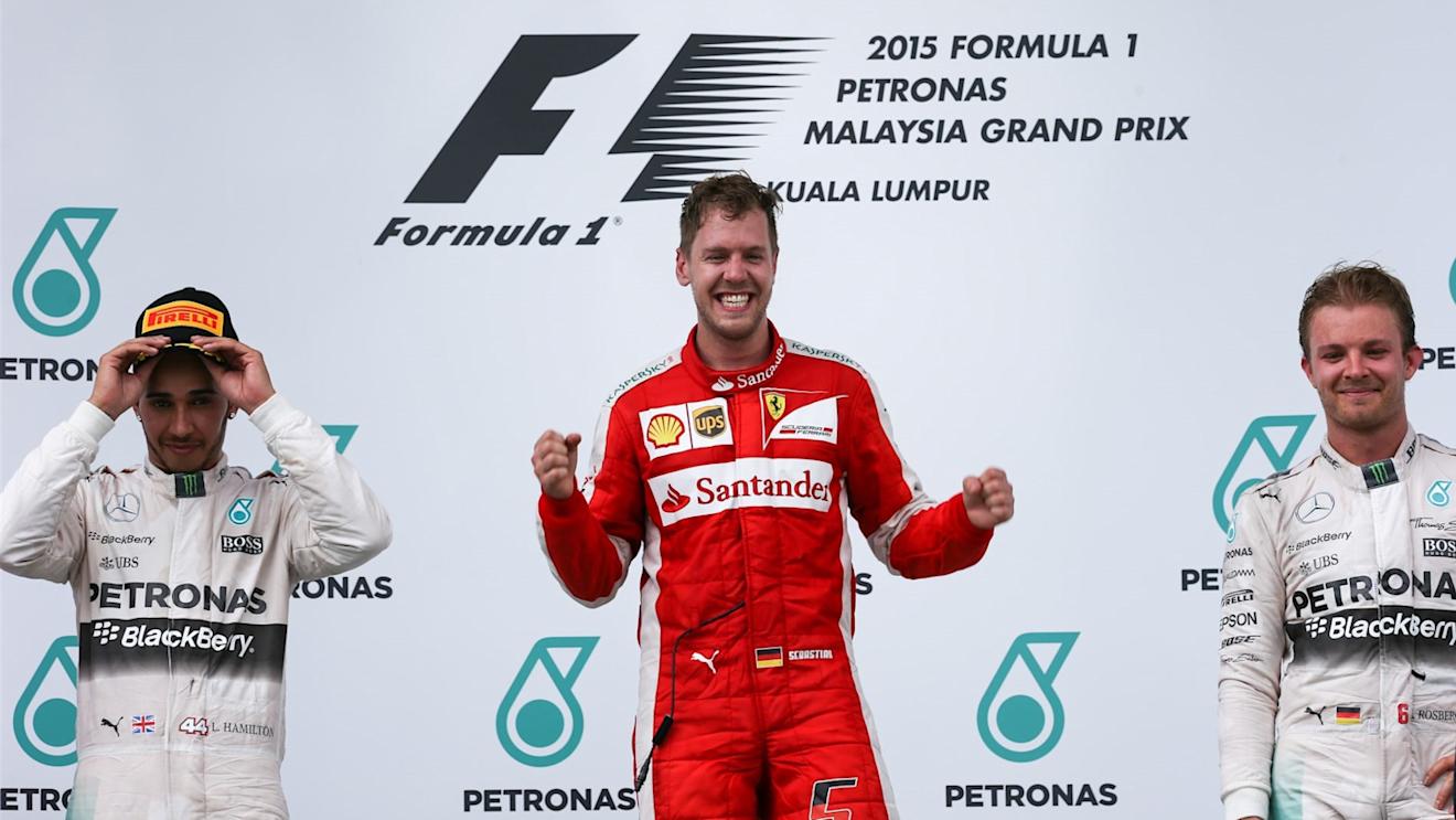 Race winner Sebastian Vettel (GER) Ferrari celebrates on the podium with Lewis Hamilton (GBR) Mercedes AMG F1 and Nico Rosberg (GER) Mercedes AMG F1 at Formula One World Championship, Rd2, Malaysian Grand Prix, Race, Sepang, Malaysia, Sunday 29 March 2015. © Sutton Motorsport Images