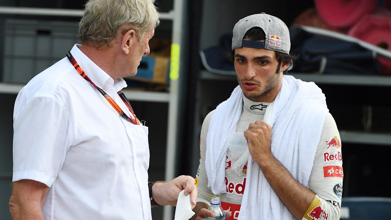 Dr Helmut Marko (AUT) Red Bull Motorsport Consultant talks with Carlos Sainz jr (ESP) Scuderia Toro Rosso at Formula One World Championship, Rd2, Malaysian Grand Prix, Race, Sepang, Malaysia, Sunday 29 March 2015. © Sutton Motorsport Images