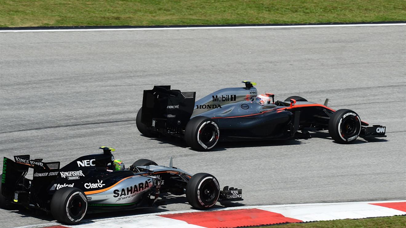 Sergio Perez (MEX) Force India VJM08 and Jenson Button (GBR) McLaren MP4-30 at Formula One World Championship, Rd2, Malaysian Grand Prix, Race, Sepang, Malaysia, Sunday 29 March 2015. © Sutton Motorsport Images