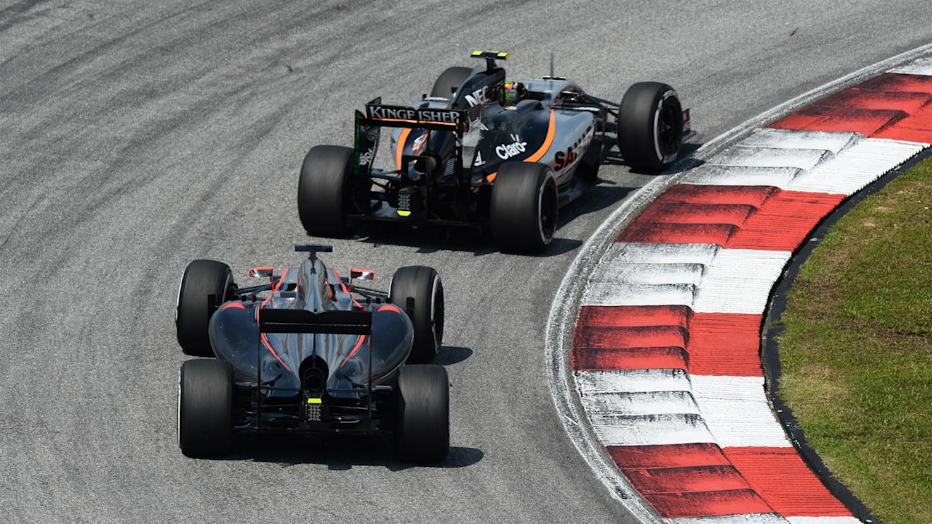 Fernando Alonso (ESP) McLaren MP4-30 and Sergio Perez (MEX) Force India VJM08 at Formula One World Championship, Rd2, Malaysian Grand Prix, Race, Sepang, Malaysia, Sunday 29 March 2015. © Sutton Motorsport Images