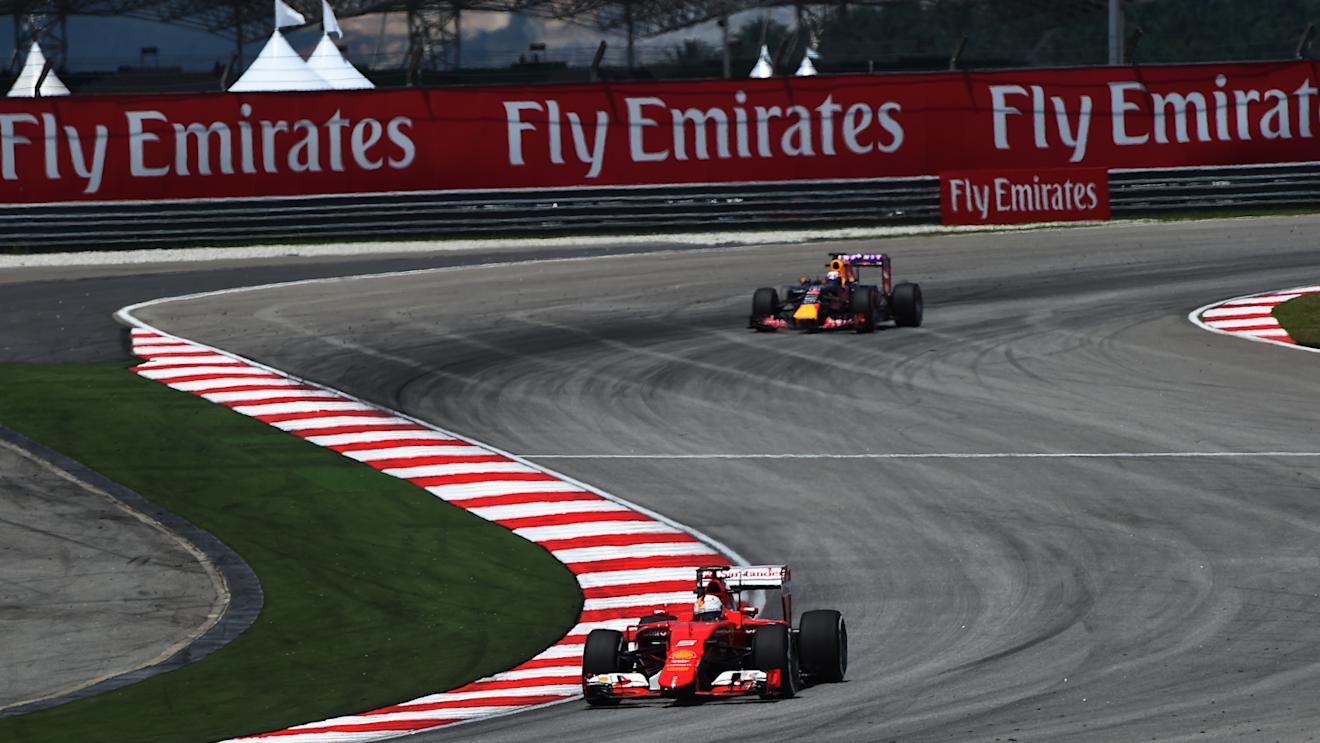 Sebastian Vettel (GER) Ferrari SF15-T leads Daniel Ricciardo (AUS) Red Bull Racing RB11 at Formula One World Championship, Rd2, Malaysian Grand Prix, Practice, Sepang, Malaysia, Friday 27  March 2015. © Sutton Motorsport Images