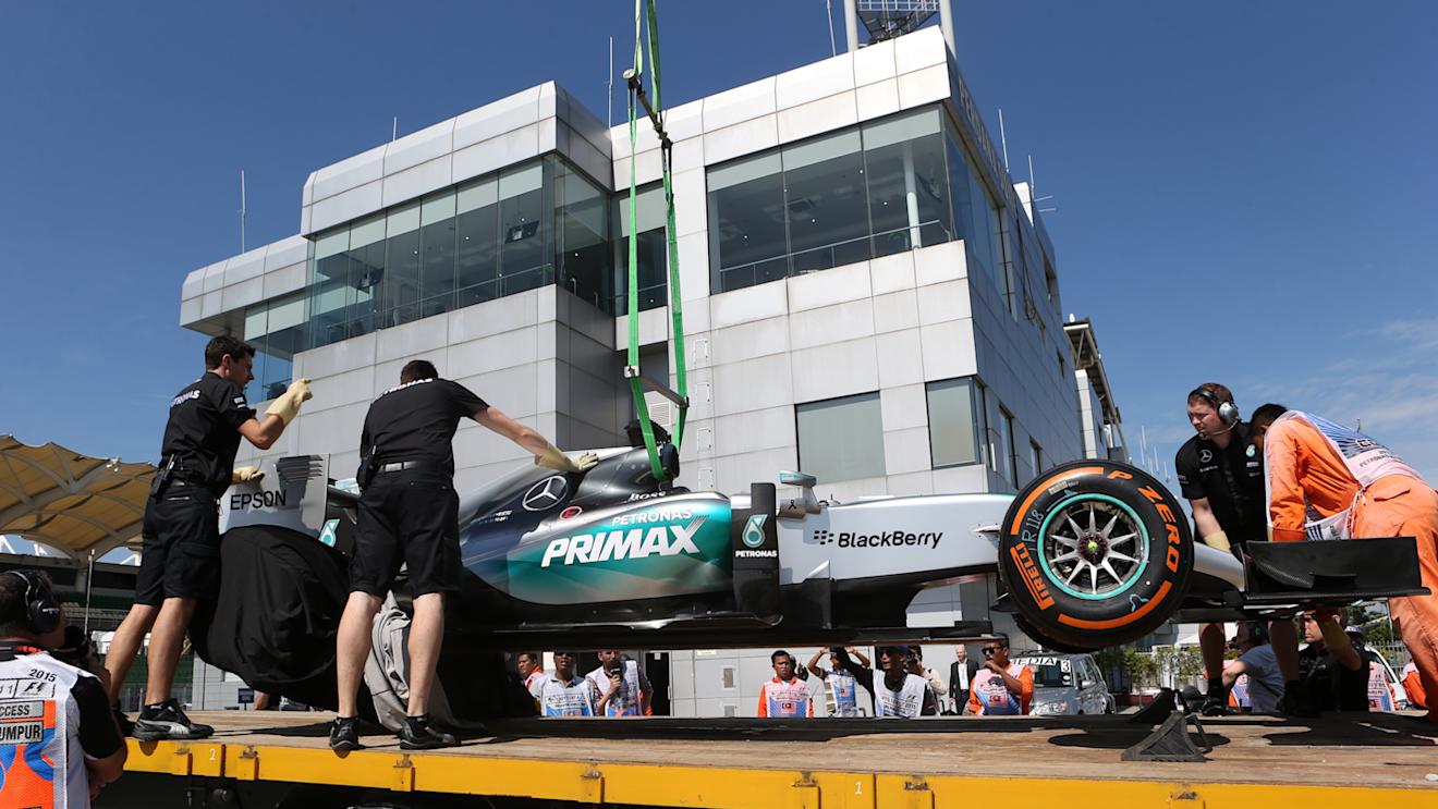 The car of Lewis Hamilton (GBR) Mercedes AMG F1 W06 is recovered to the pits in Free Practice One at Formula One World Championship, Rd2, Malaysian Grand Prix, Practice, Sepang, Malaysia, Friday 27  March 2015. © Sutton Motorsport Images
