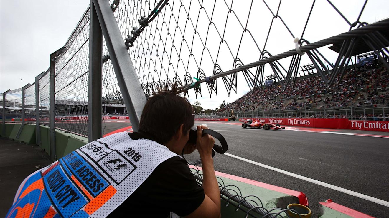 Sebastian Vettel (GER) Ferrari SF15-T and photographer at Formula One World Championship, Rd17, Mexican Grand Prix, Qualifying, Circuit Hermanos Rodriguez, Mexico City, Mexico, Saturday 31 October 2015. © Sutton Motorsport Images