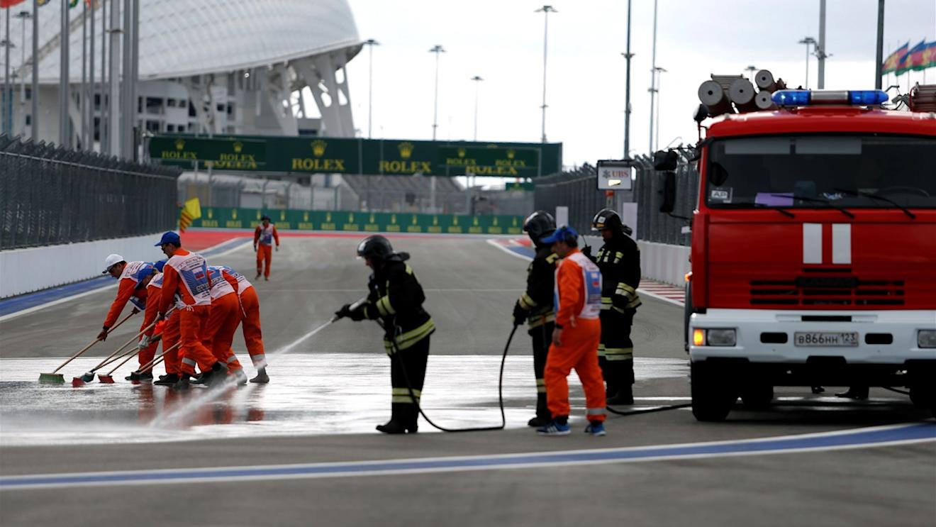 Marshals and Firemen clean the track at Formula One World Championship, Rd15, Russian Grand Prix, Practice, Sochi Autodrom, Sochi, Krasnodar Krai, Russia, Friday 9 October 2015. © Sutton Motorsport Images