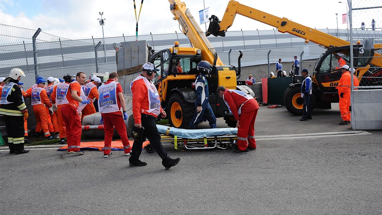 Medical crew and marshals work to extract the crashed car of Carlos Sainz (ESP) Scuderia Toro Rosso STR10 following his crash in FP3 at Formula One World Championship, Rd15, Russian Grand Prix, Qualifying, Sochi Autodrom, Sochi, Krasnodar Krai, Russia, Saturday 10 October 2015. © Sutton Motorsport Images