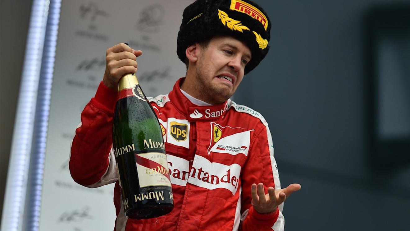 Sebastian Vettel (GER) Ferrari celebrates with the champagne on the podium at Formula One World Championship, Rd15, Russian Grand Prix, Race, Sochi Autodrom, Sochi, Krasnodar Krai, Russia, Sunday 11 October 2015. © Sutton Motorsport Images