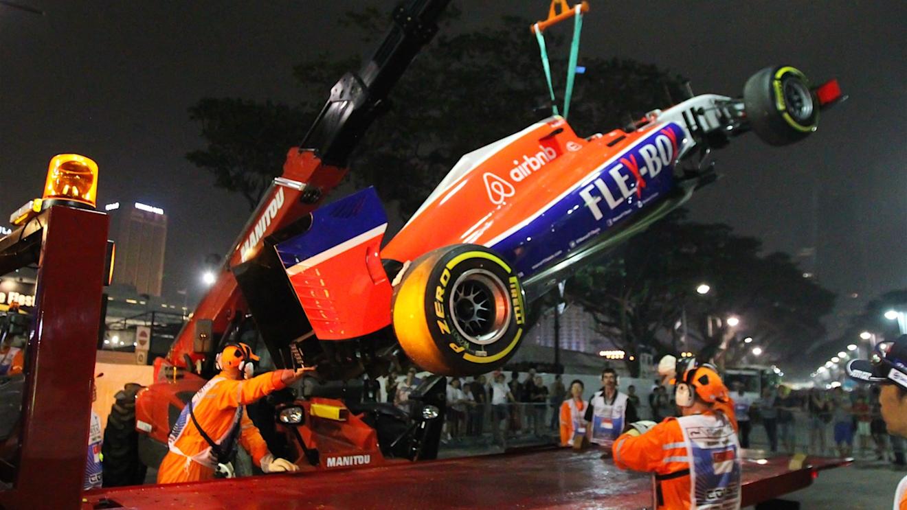 The car of Will Stevens (GBR) Marussia is recovered after crashing out in FP2 at Formula One World Championship, Rd13, Singapore Grand Prix, Practice, Marina Bay Street Circuit, Singapore, Friday 18 September 2015. © Sutton Motorsport Images