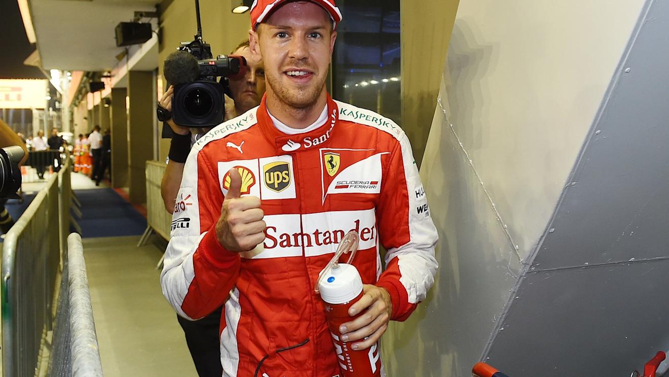 Pole sitter Sebastian Vettel (GER) Ferrari celebrates in parc ferme at Formula One World Championship, Rd13, Singapore Grand Prix, Qualifying, Marina Bay Street Circuit, Singapore, Saturday 19  September 2015. © Sutton Motorsport Images