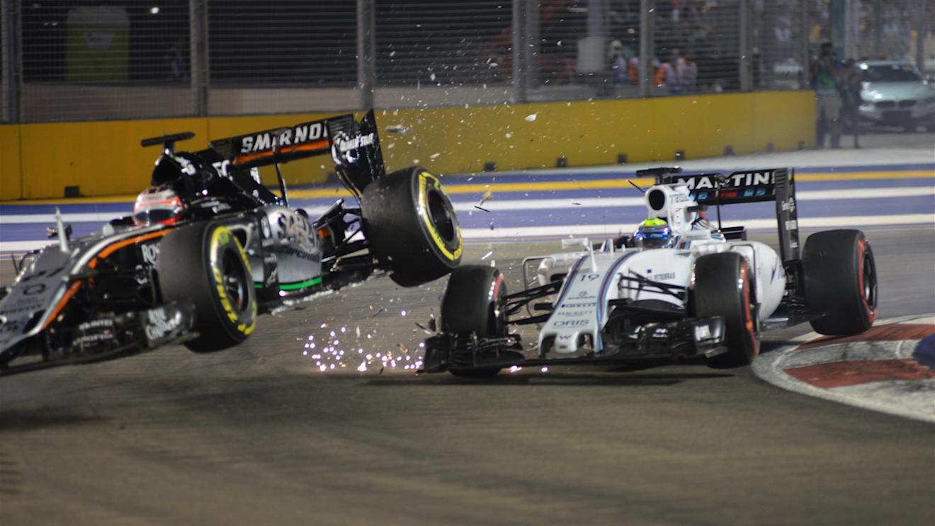 Nico Hulkenberg (GER) Force India VJM08 and Felipe Massa (BRA) Williams FW37 collide at Formula One World Championship, Rd13, Singapore Grand Prix, Race, Marina Bay Street Circuit, Singapore, Sunday 20 September 2015. © Sutton Motorsport Images