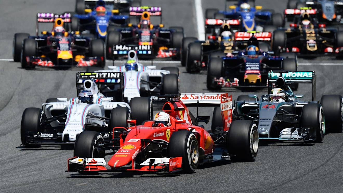 Sebastian Vettel (GER) Ferrari SF15-T and Lewis Hamilton (GBR) Mercedes AMG F1 W06 battle at the start at Formula One World Championship, Rd5, Spanish Grand Prix Race, Barcelona, Spain, Sunday 10 May 2015. © Sutton Motorsport Images